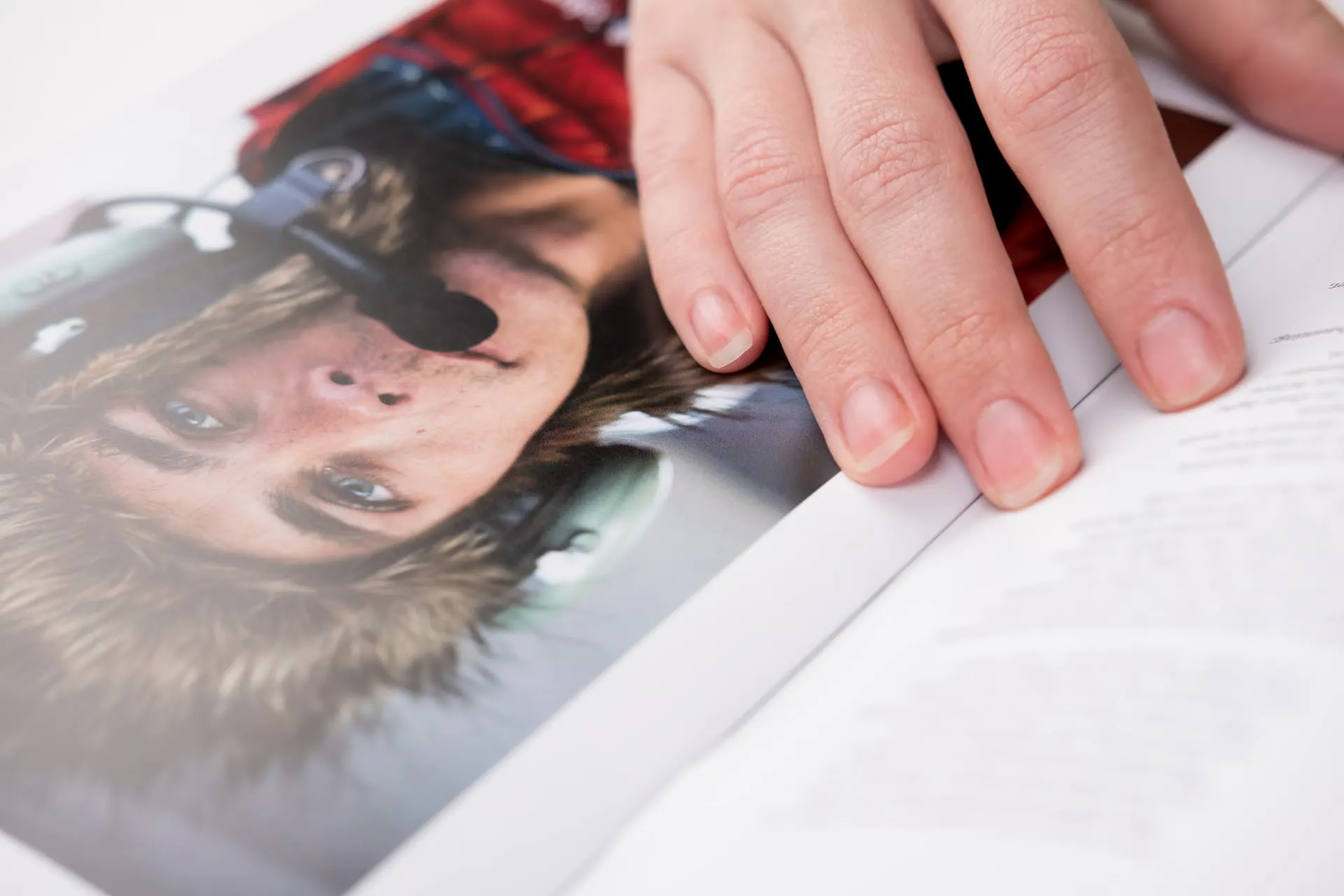 Hand over photo of man with microphone.