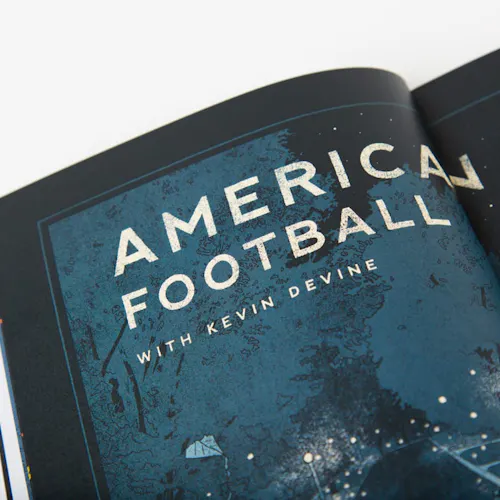 A portfolio booklet laying open to a midnight blue and black illustration with American Football printed in white.