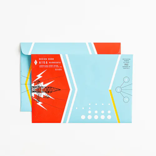 A direct mailer envelope printed with a blue, red and white design and Design Show AIGA Minnesota in the corner.
