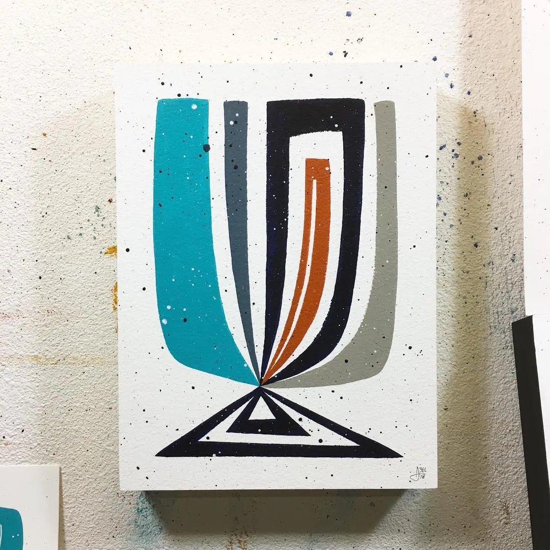 A custom art print with an abstract design in teal, gray, black and red.