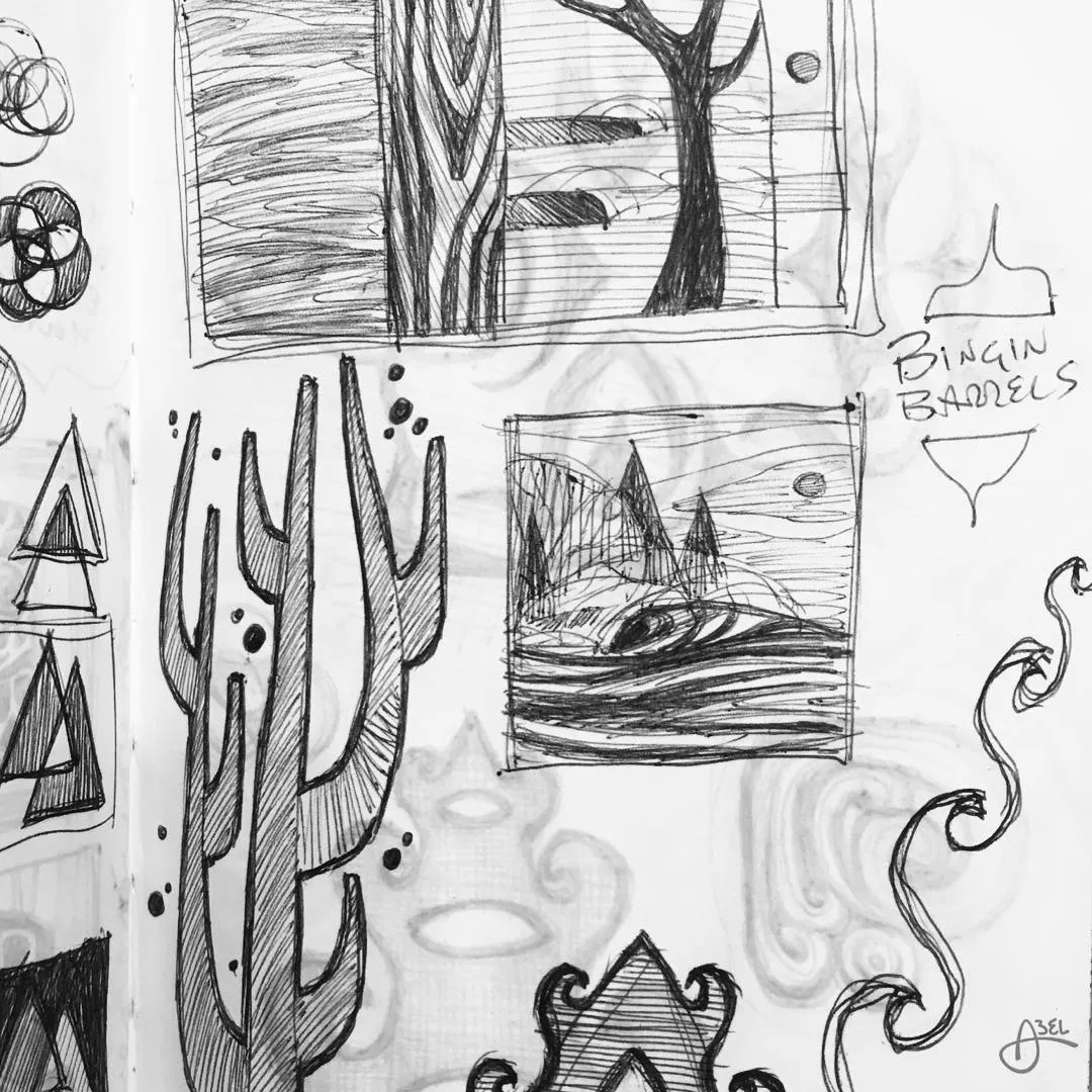 A page from a sketchbook with various designs, including cacti, trees, waves and geometric shapes.