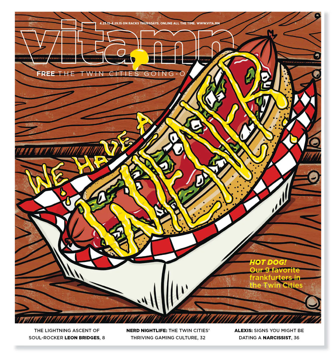 A custom magazine printed with a graphic of a hotdog with mustard and Vita.mn in white text at the top.