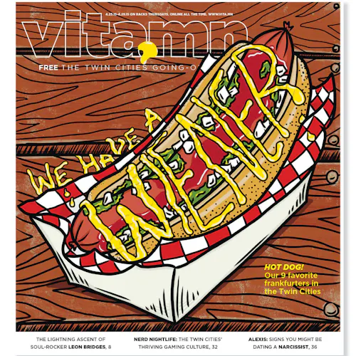 A custom magazine printed with a graphic of a hotdog with mustard and Vita.mn in white text at the top.