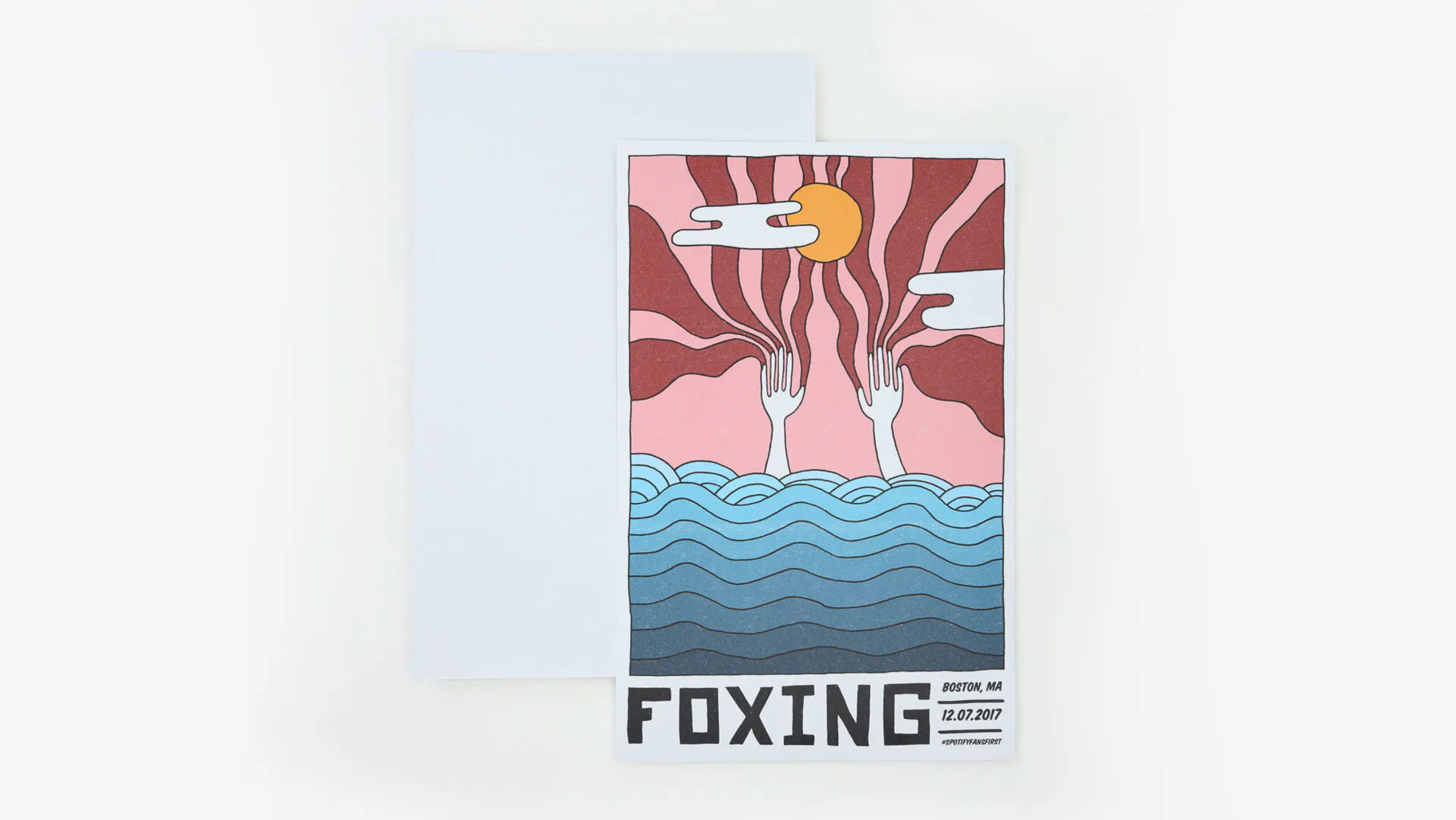 A cardstock sign printed with Foxing below a sunshine and waves design in shades of pink, maroon and blue.