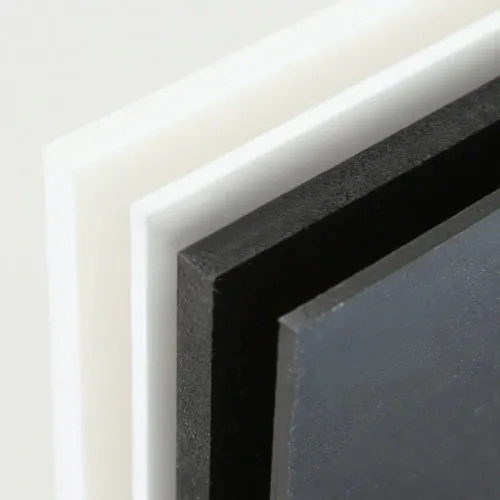 Two white and two black PVC foam signs lined up next to each other showing different thicknesses.