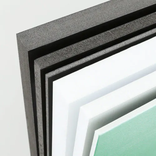 Three black and three white polystyrene foam signs lined up with various thicknesses.