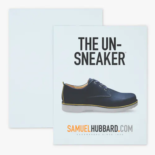 Styrene A custom styrene sign printed with The Un-Sneaker and an image of a black shoe with a white sole.