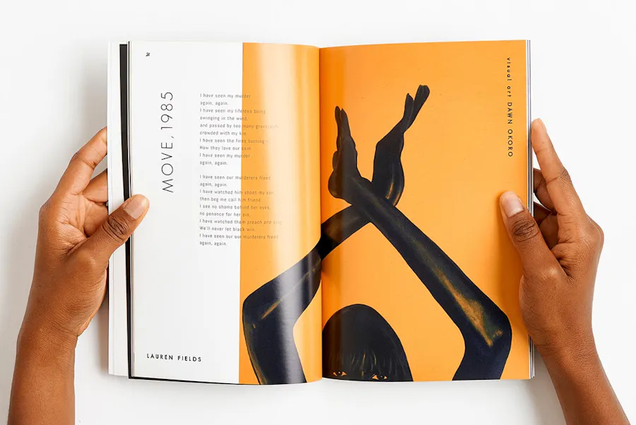 Two hands holding a booklet with a perfect binding open to a person crossing their arms above their head.