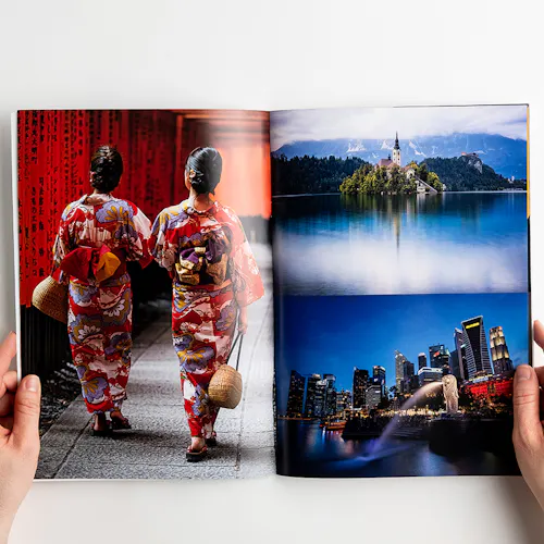 ©Brian Hammonds Photography A photography book laying open to images of two Asian woman in floral outfits, a city at night and a castle.