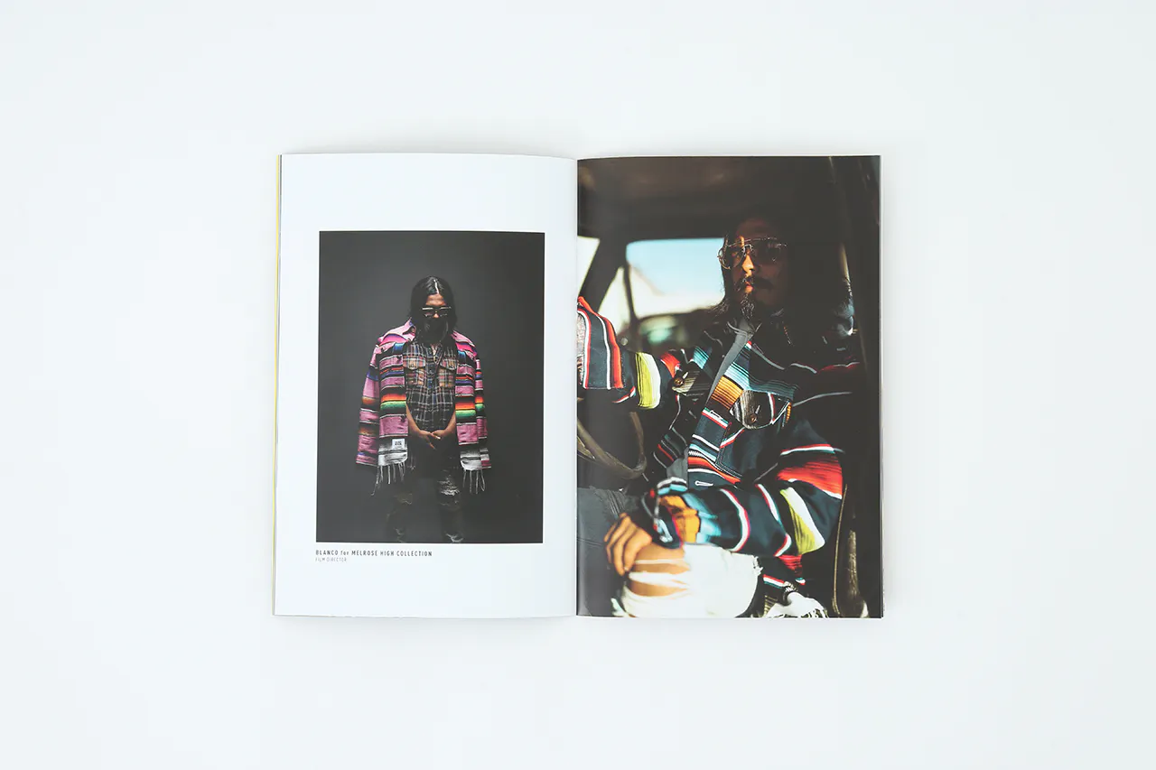 A portfolio printed with images of a man wearing a striped poncho and sitting in a car.