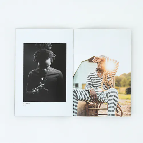 ©Steve West Photo A portfolio printed with images of a man looking down clasping his hands and a man in a striped suit sitting in a chair.