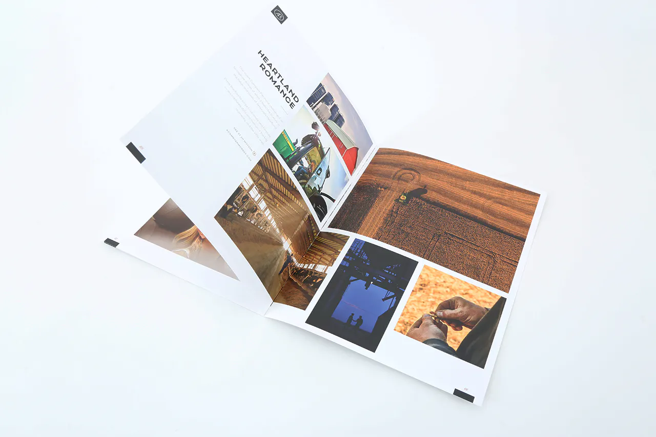 A photography portfolio laying open to various farming images and printed with Heartland Romance.