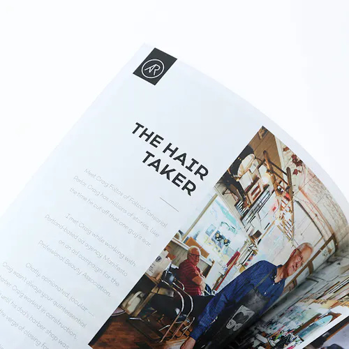 ©Adam Ryan Morris A photography portfolio flipping open to an image of a barbershop and printed with The Hair Taker.