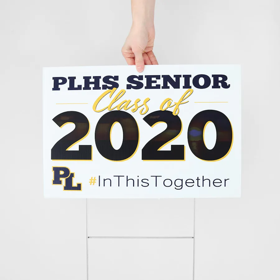 A graduation yard sign with PLHS Senior 2020 and In This Together in a black and yellow design.