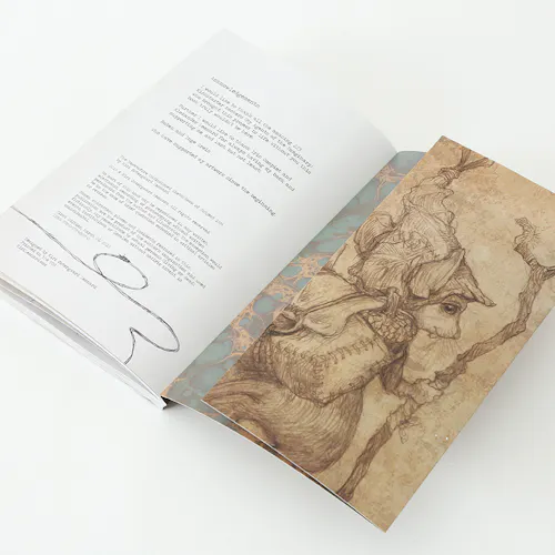 A sketchbook laying open to the back panel with an illustration of a mouse wearing a bonnet and walking with a stick.