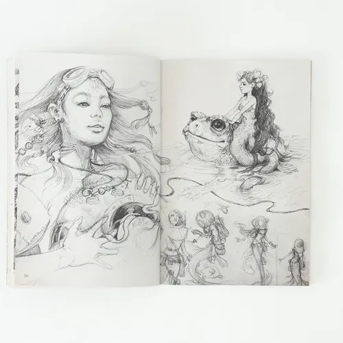 A sketchbook laying open to illustrations of a woman with flowing hair and a girl sitting on a frog.
