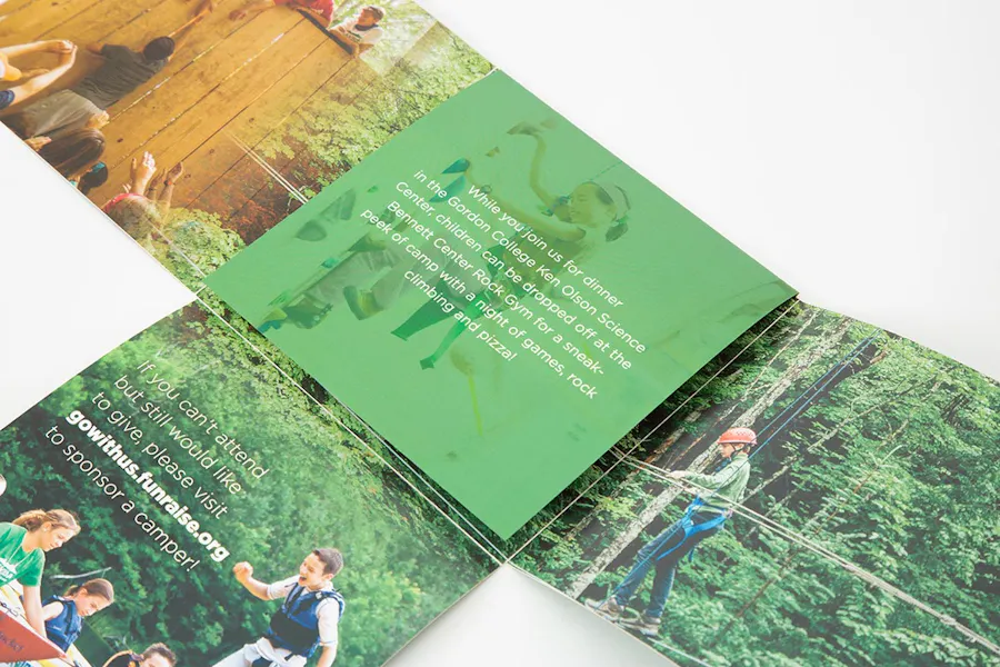 A piece of creative direct mail with a square folded cross format and outdoor imagery.