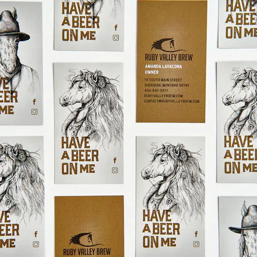 Custom business cards in rows printed with a vertical orientation, horse sketches and Have a Beer on Me.