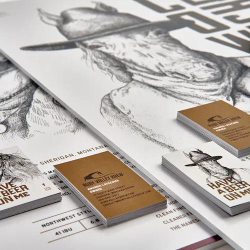 Marketing posters and business cards for Ruby Valley Brew printed with black and white horse graphics.