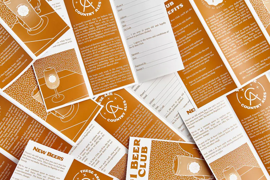 A collage of scattered beer club brochures for a brewery.