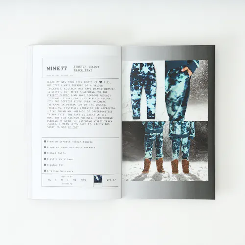 A Mine77 lookbook laying open to images of two people wearing printed track pants and details about them.