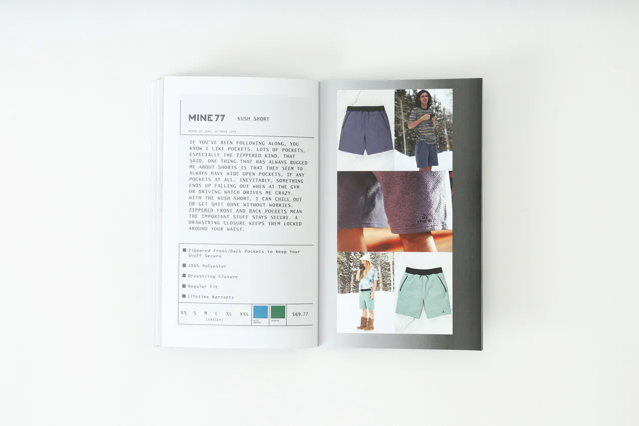 A Mine77 lookbook laying open to product images of a pair of shorts and details about it.