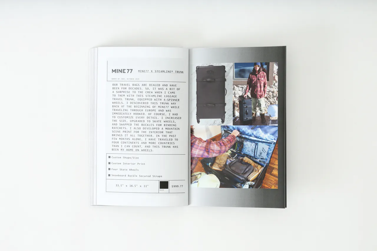 A Mine77 lookbook laying open to images of a travel suitcase filled with clothes and details about it.