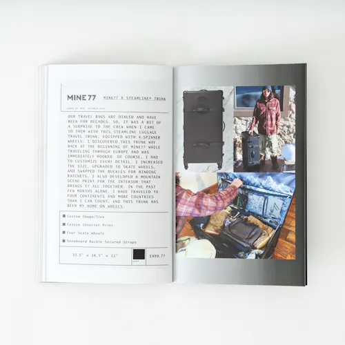 A Mine77 lookbook laying open to images of a travel suitcase filled with clothes and details about it.