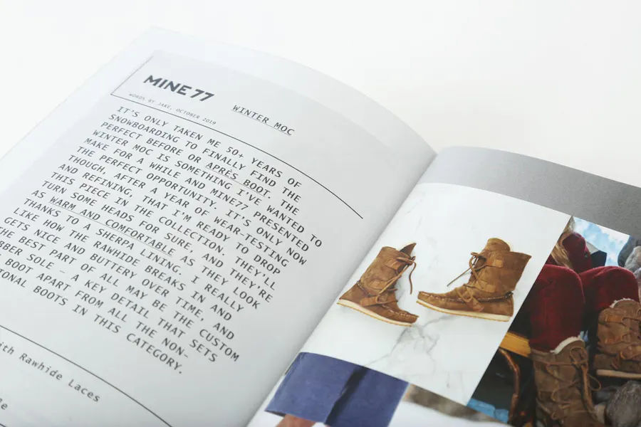 The Burton Mine77 product lookbook laying open to images of boots and product details.