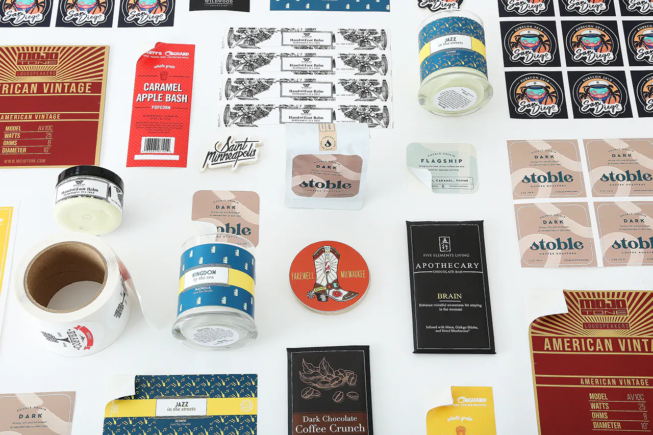 A variety of custom printed labels and stickers in various shapes for candles, coffee and chocolate.