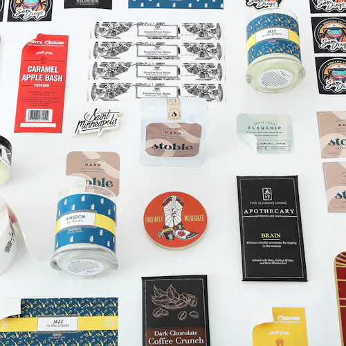 A variety of custom printed labels and stickers in various shapes for candles, coffee and chocolate.