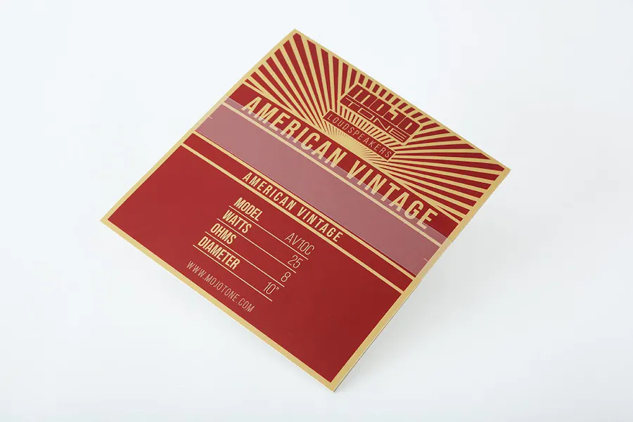 A custom sticker printed with a red and gold design and Mojo Tone Loudspeakers at the top.