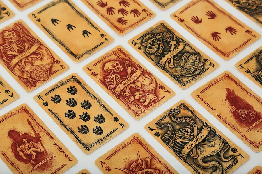 Custom playing cards laid out in rows with skeleton artwork on each one.