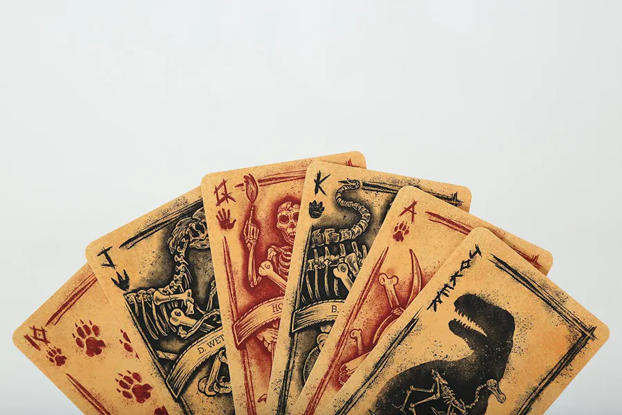 Custom playing cards designed with collated printing and skeleton designs.