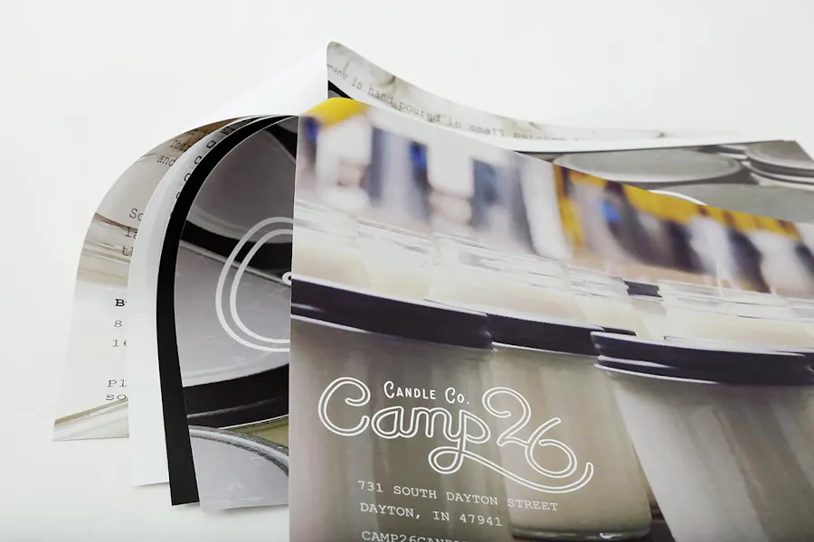 A marketing packet stapled in the top left corner and printed with Candle Co. Camp 26 on the front.