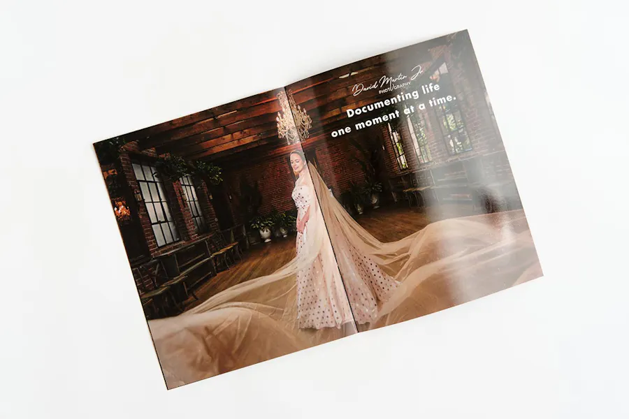 A marketing booklet laying open to a spread showing a woman in a wedding dress.