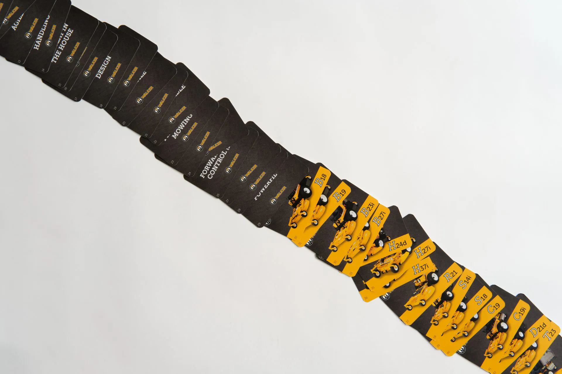 A stack of product information flashcards with a black and yellow design fanned out in a line.