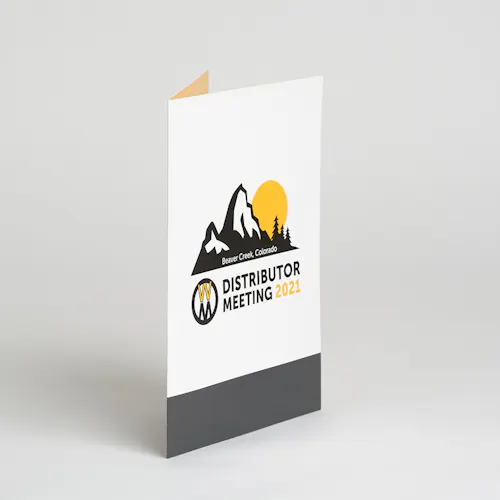 A custom pocket folder printed with Distributor Meeting 2021 in black and yellow on the front.