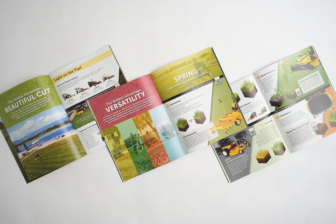 Three Walker Mower marketing catalogs laying open and overlapping each other with mower info and imagery.