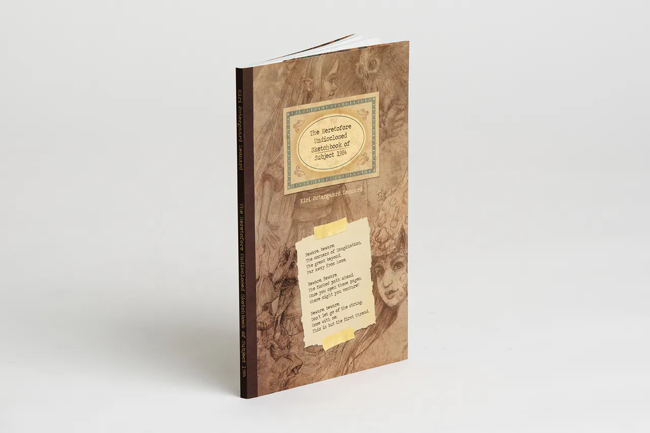 A custom booklet printed with illustrated sketches on the sepia-toned cover.
