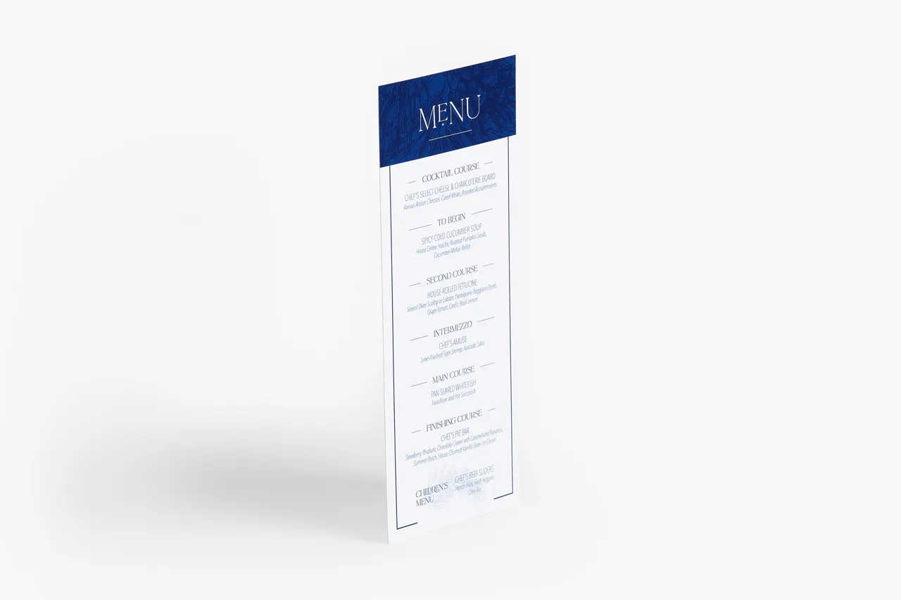 A menu card for a wedding reception printed with a navy and white design and details for three courses.