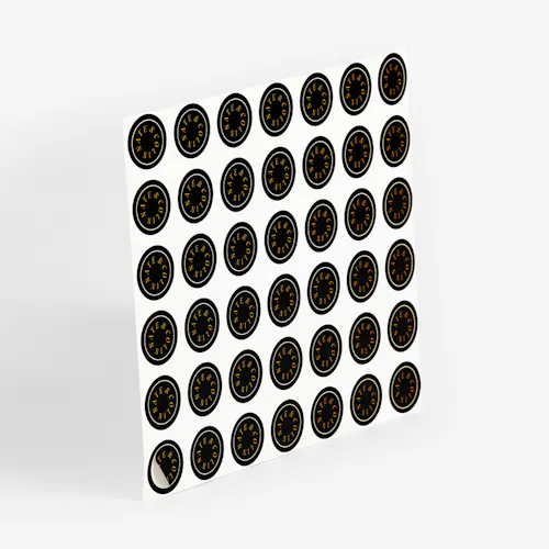 STICKER SEAL: CRACK 'N' PEEL LABEL - 60# MATTE WHITE, KISS CUT SHEET, 1 X 1" A sheet of custom sticker seals printed with a black background and Nate & Colin in gold.