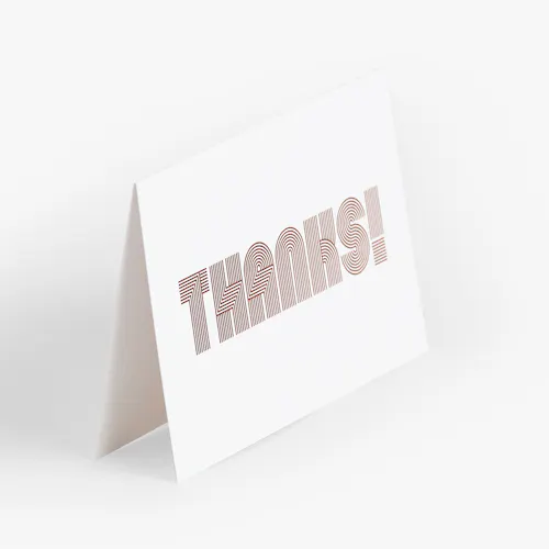 THANK YOU CARD: 100# COATED MATTE WHITE COVER, HALF FOLD, 8 X 6" FOLDED TO 4 X 6" A thank you card printed with Thanks! on the front in a thick, striped font.