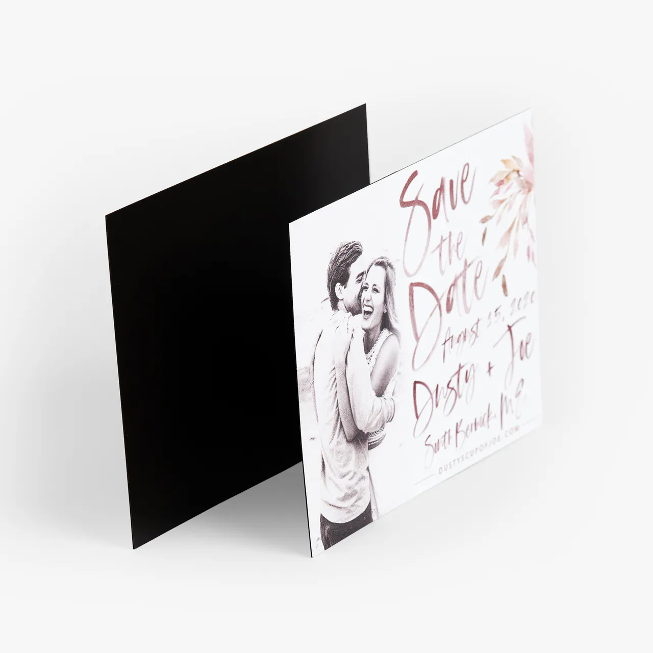 A save the date magnet printed with a man and woman smiling and hugging and Dusty & Joe in scripted letters.