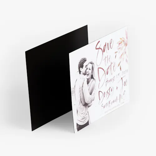 SAVE THE DATE MAGNET: 4.25 X 5.5" A save the date magnet printed with a man and woman smiling and hugging and Dusty & Joe in scripted letters.