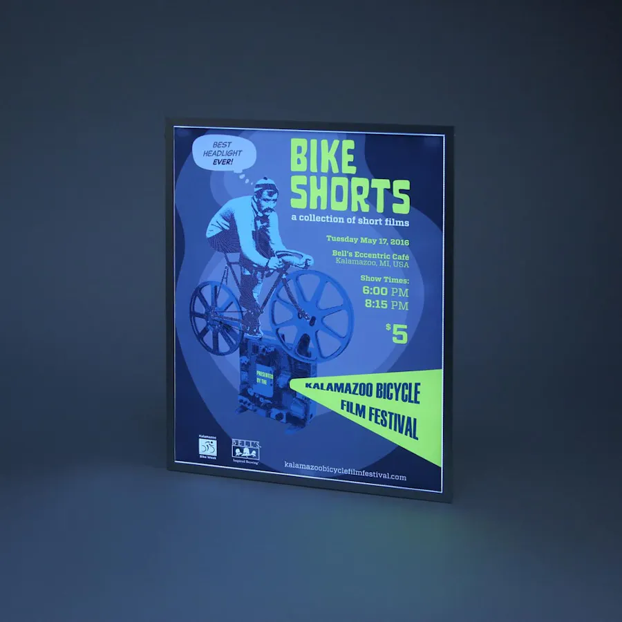 A custom backlit sign with "Bike Shorts" in lime green and a man on a bike in blue.