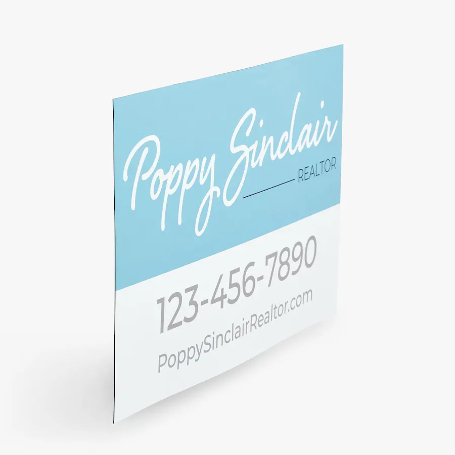 A real estate car magnet printed with Poppy Sinclair Realtor in a light blue and white design.