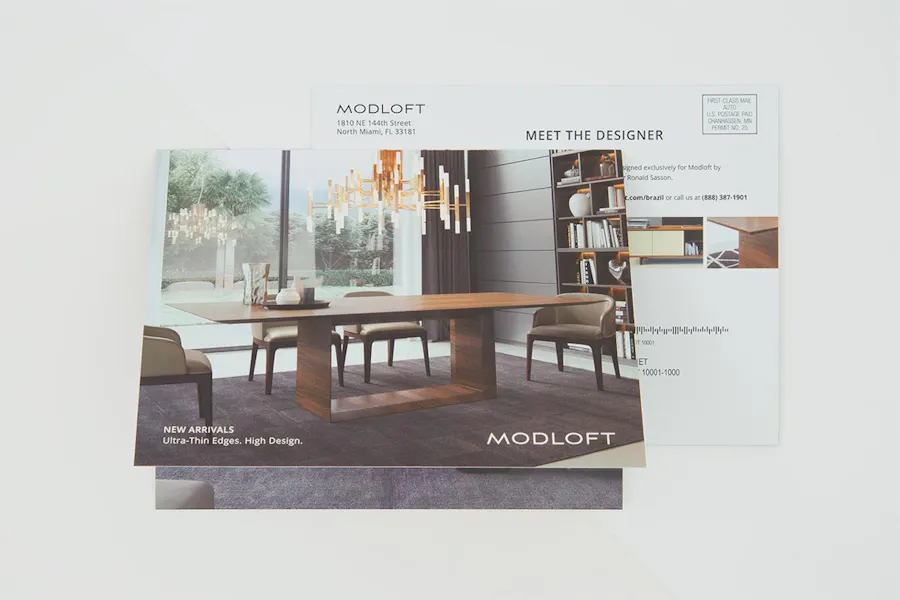 Two real estate direct mail postcards with Modloft in white text and imagery of a dining room table and chairs.