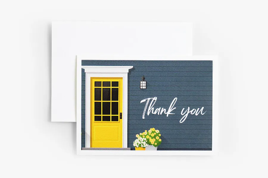 A custom thank you card with a graphic of a house with a yellow door and a flower pot on the front.