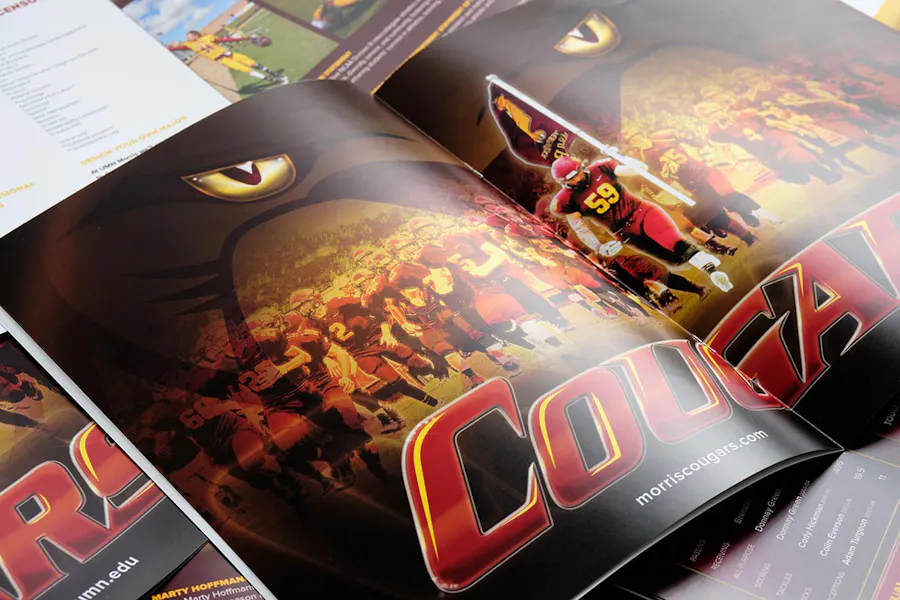 A custom printed marketing booklet laying open showing a sports team.